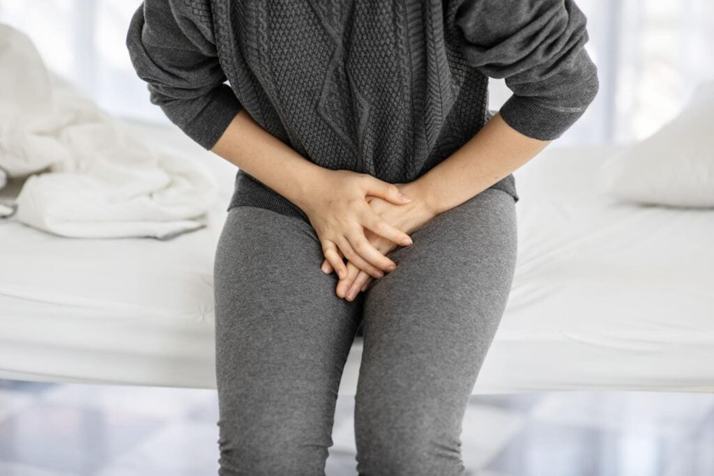 A woman feeling itchy from yeast infection
