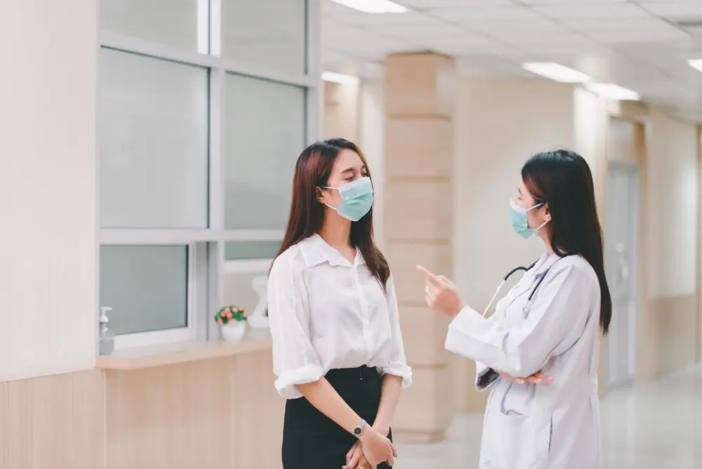 A doctor talking to her female patient