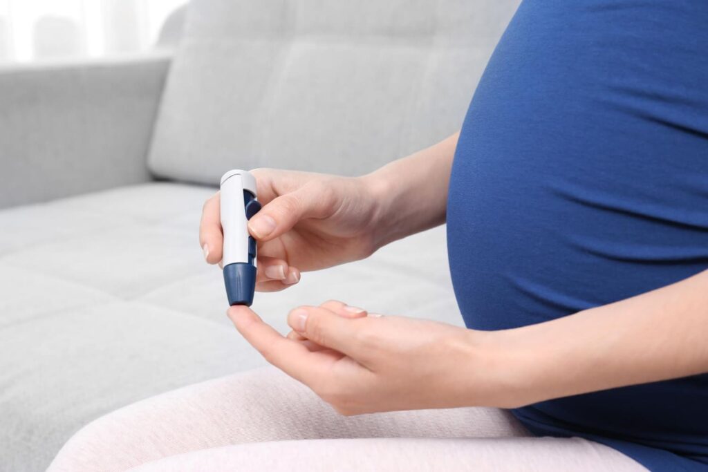 A woman with a blood sugar level checker